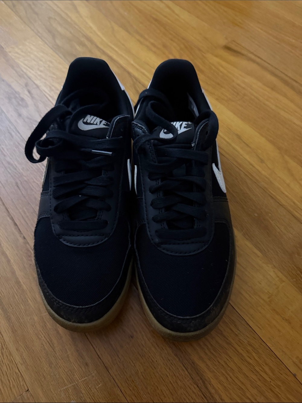 Nike Black Low-Top Sneakers with White Swoosh Accents